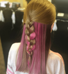 Girl with blonde and pink hair bribed on the back