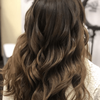 Woman with curled brown hair