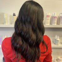 A woman with long black and red hair